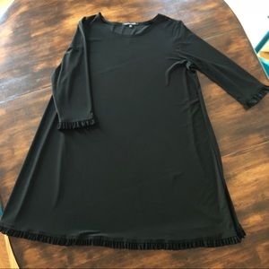 Women’s black dress with ruffle edges
